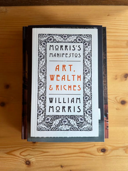 Art_Wealth_Riches_William_Morris Book on wooden surface.